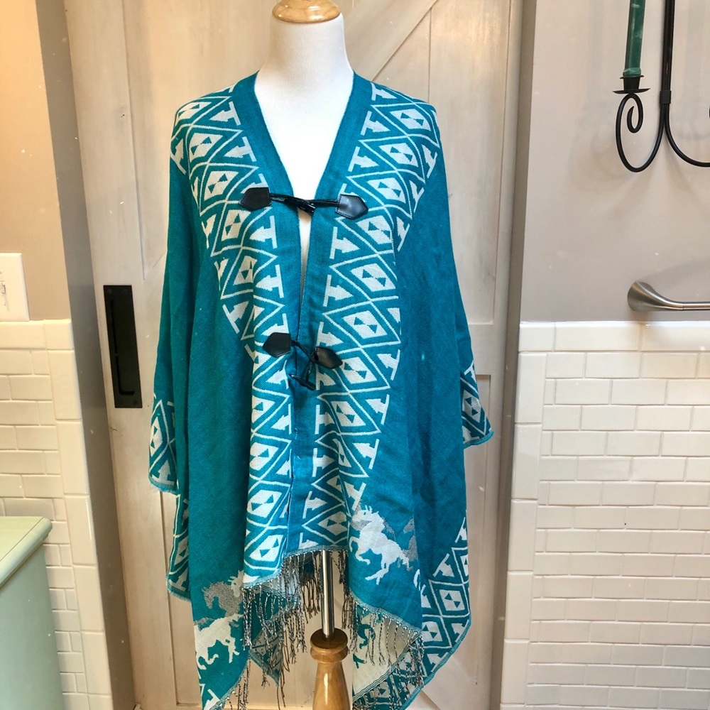 Step in style reversable poncho